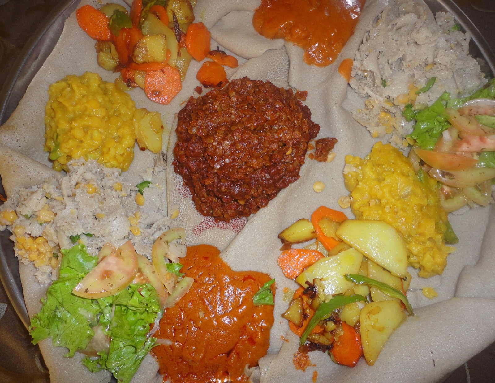 Beyaynetu, a platter of fasting dishes on injera