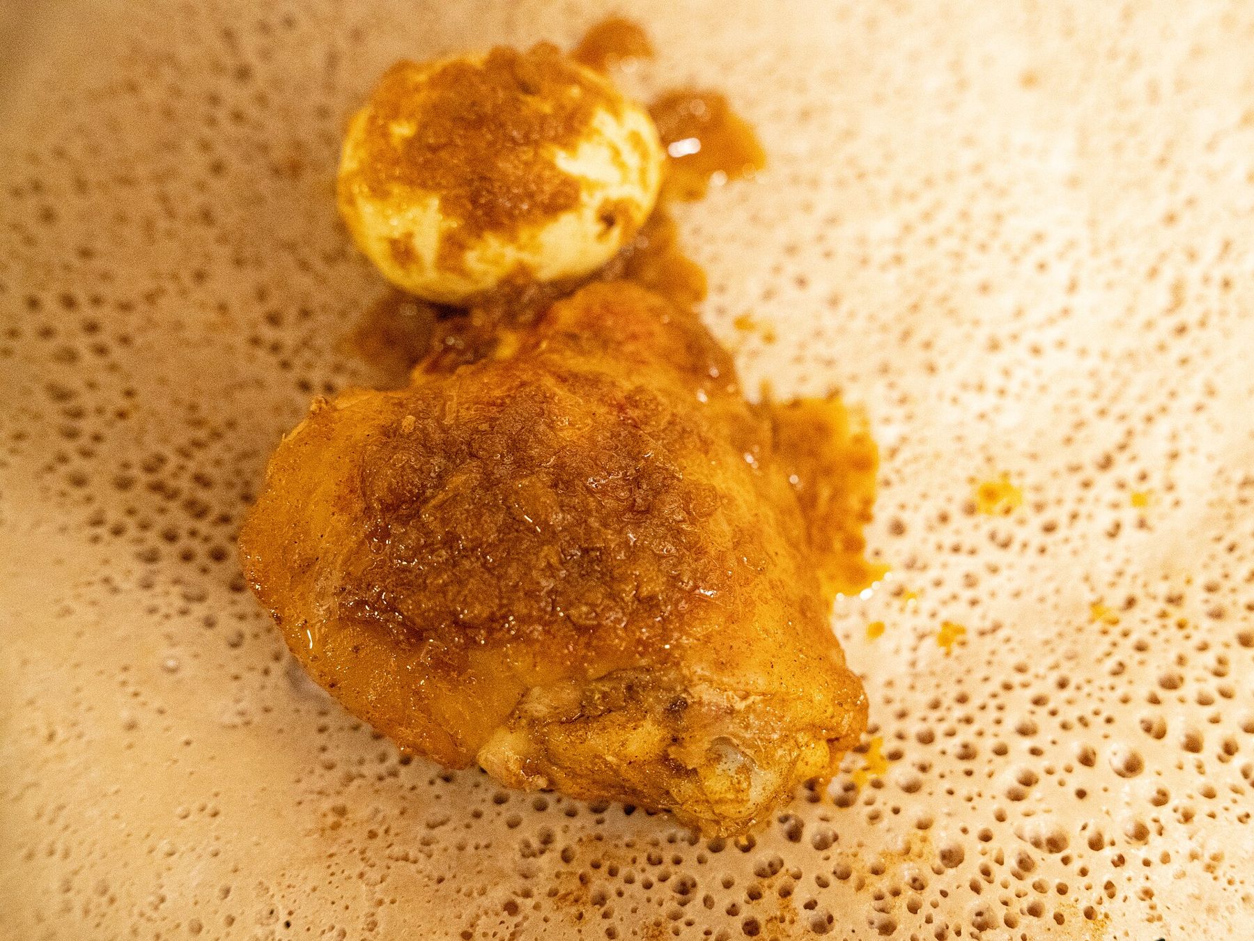 Doro wat with a boiled egg on injera, a dish for feast days