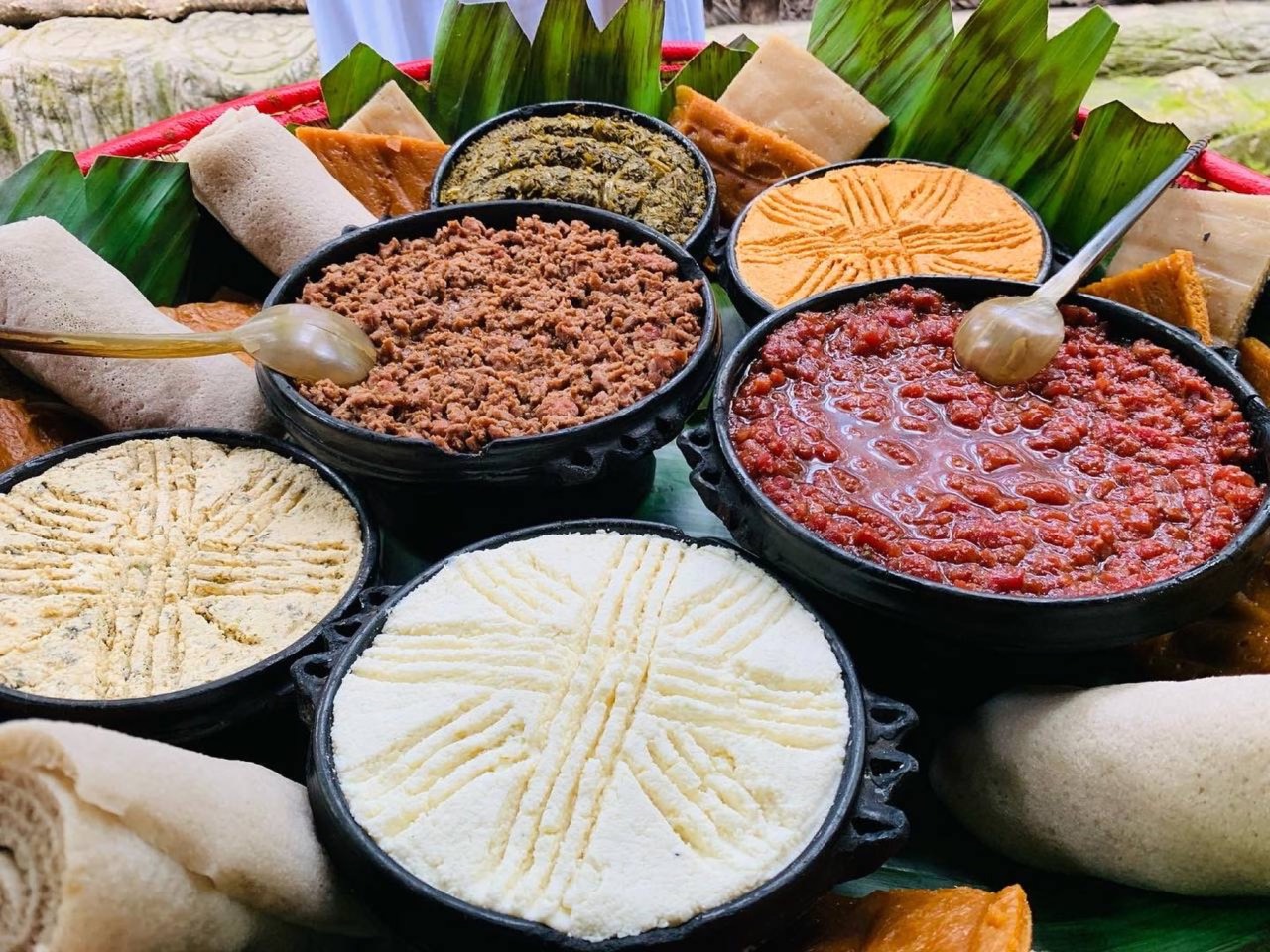 Kitfo and other feast dishes laid out for a celebration