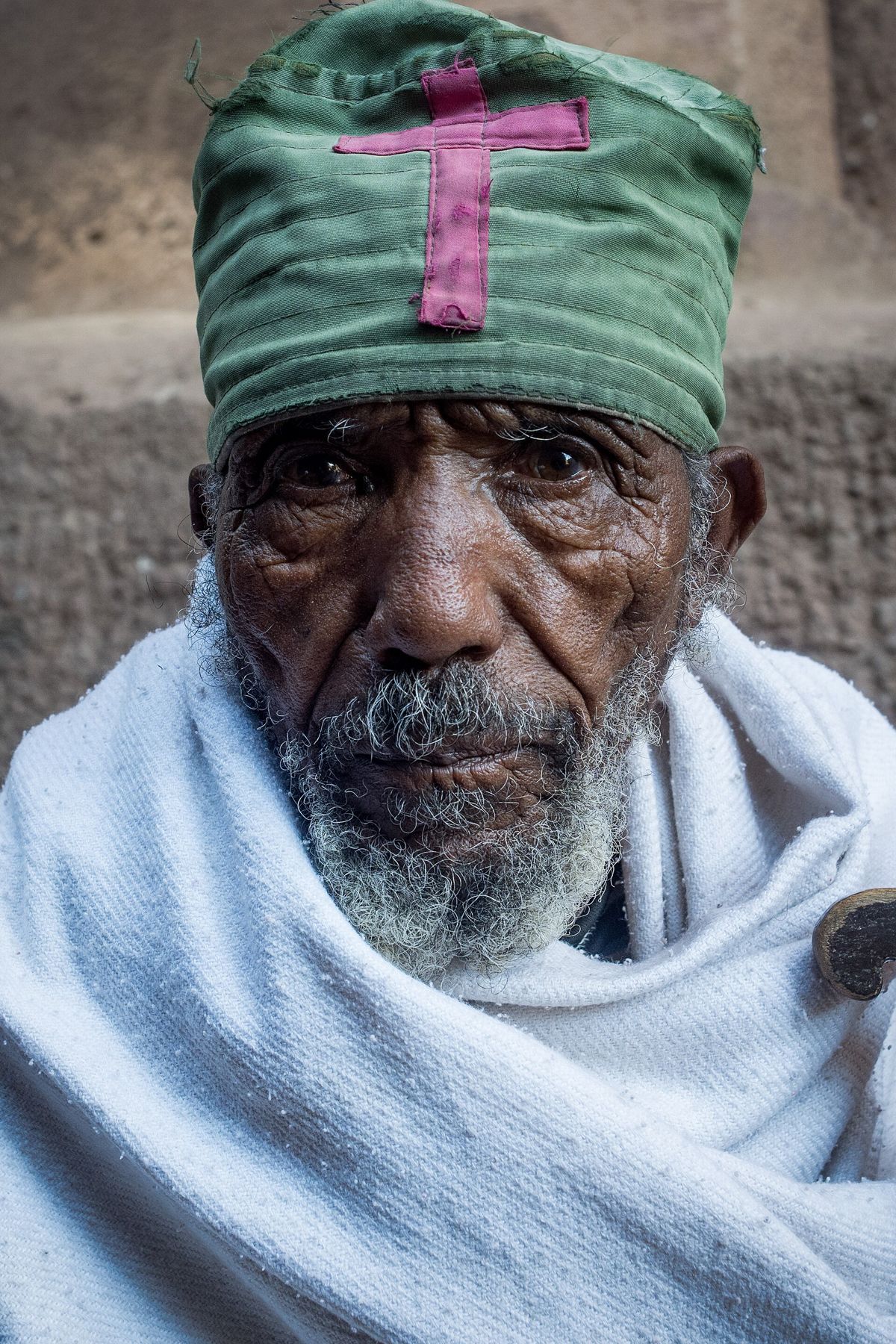 A monk in Lalibela wrapped in a white shawl