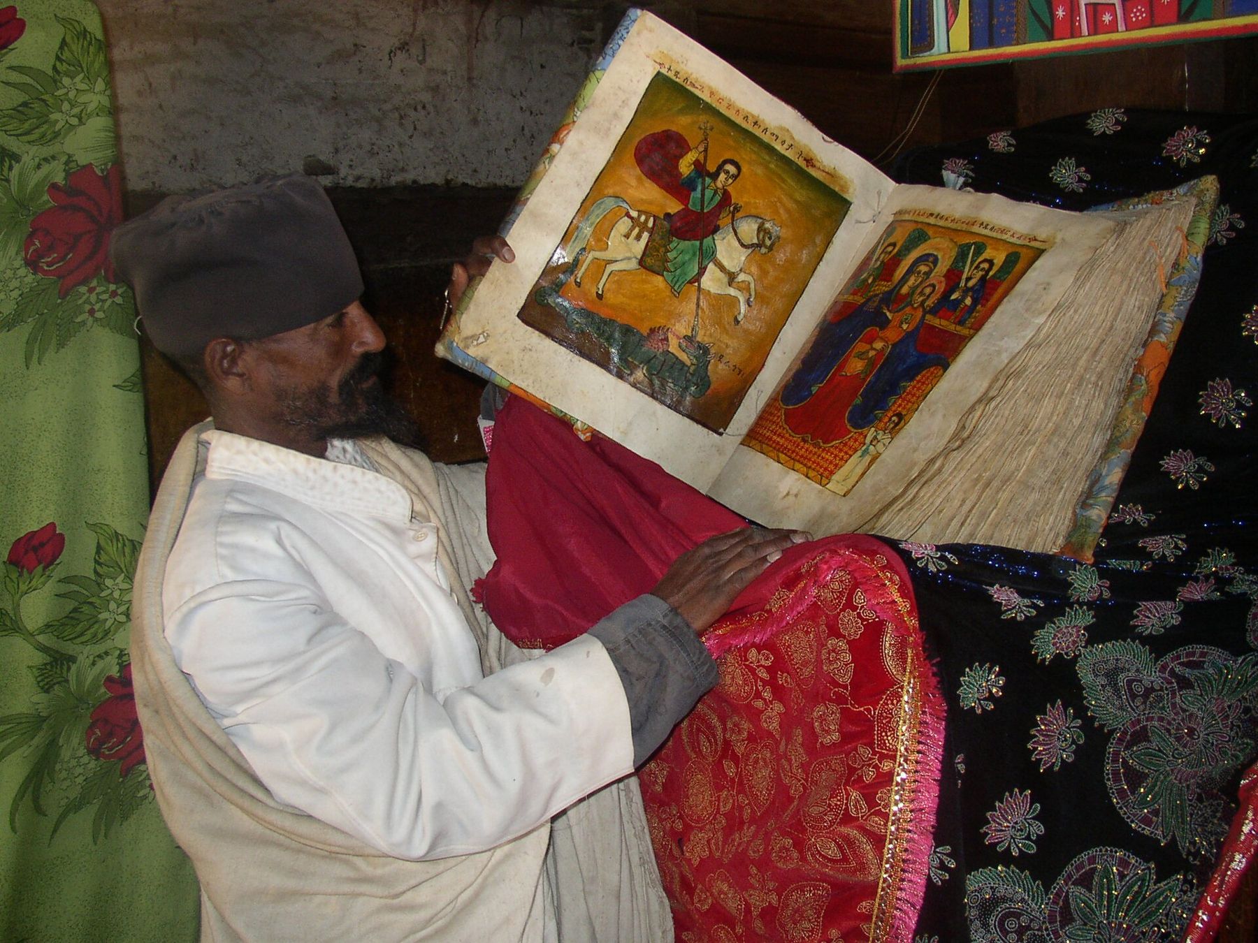 An Ethiopian Orthodox monk reading an illuminated manuscript