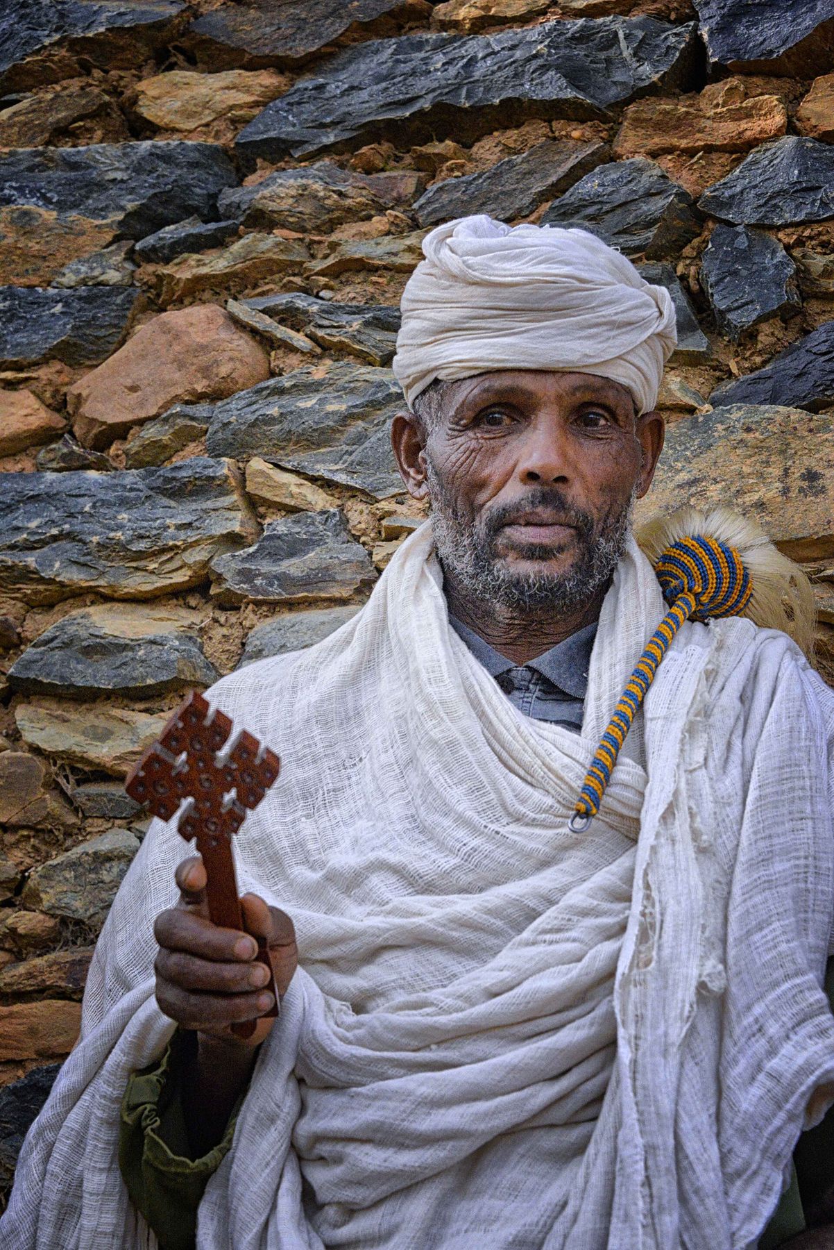 An Ethiopian Orthodox priest in Tigray holding a hand cross