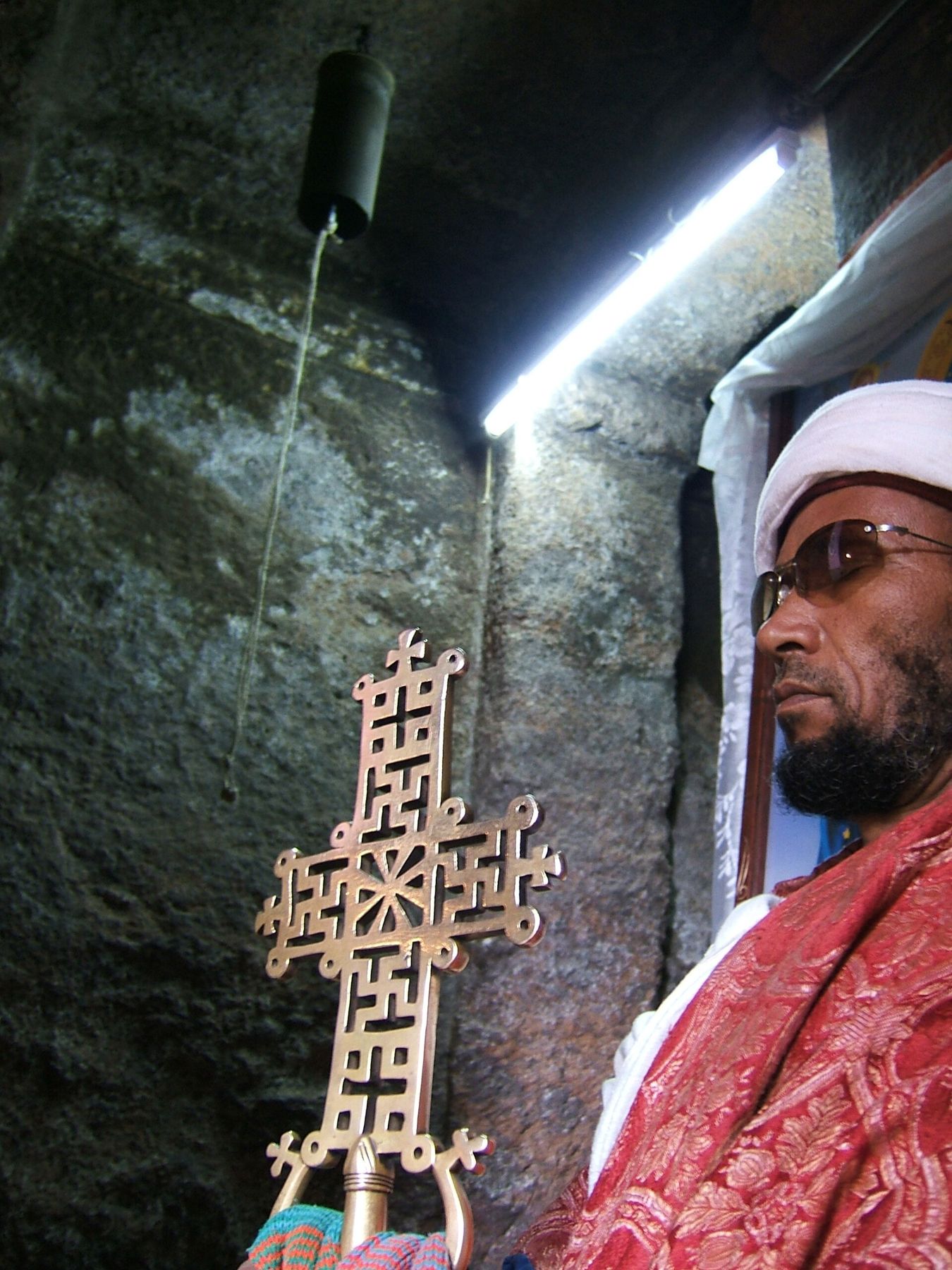A priest holding a processional cross