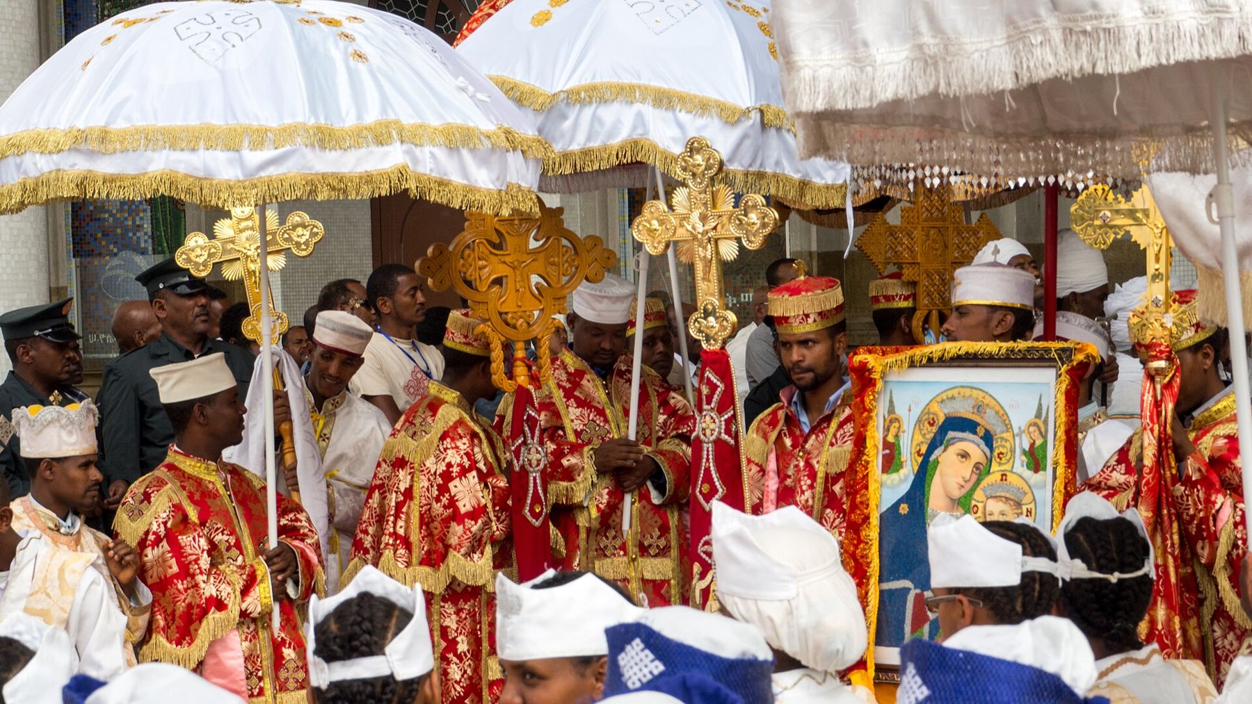 Priests under liturgical umbrellas carrying the tabot during Timkat